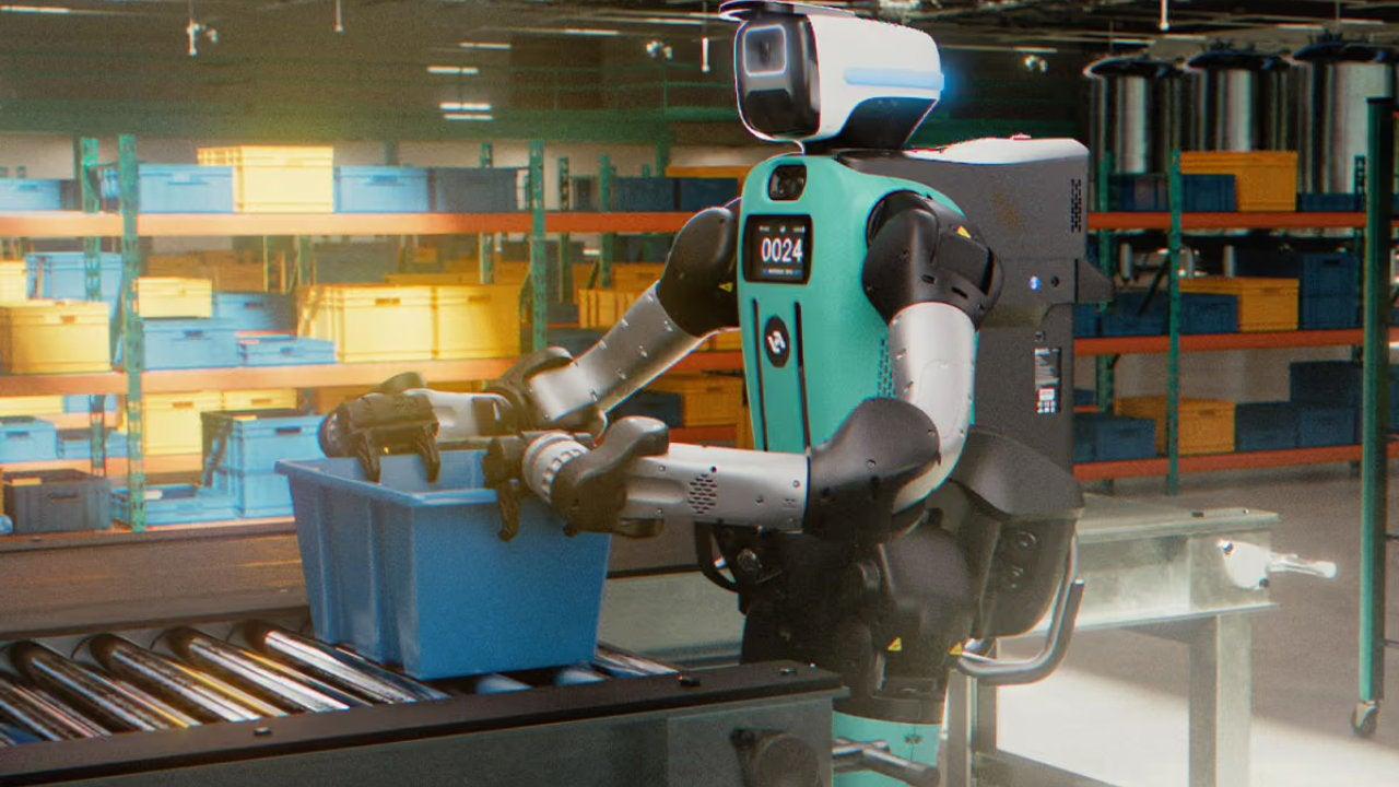 Digit 5 de Agility Robotics compartiendo espacio con trabajadores Robot humanoide en almacén